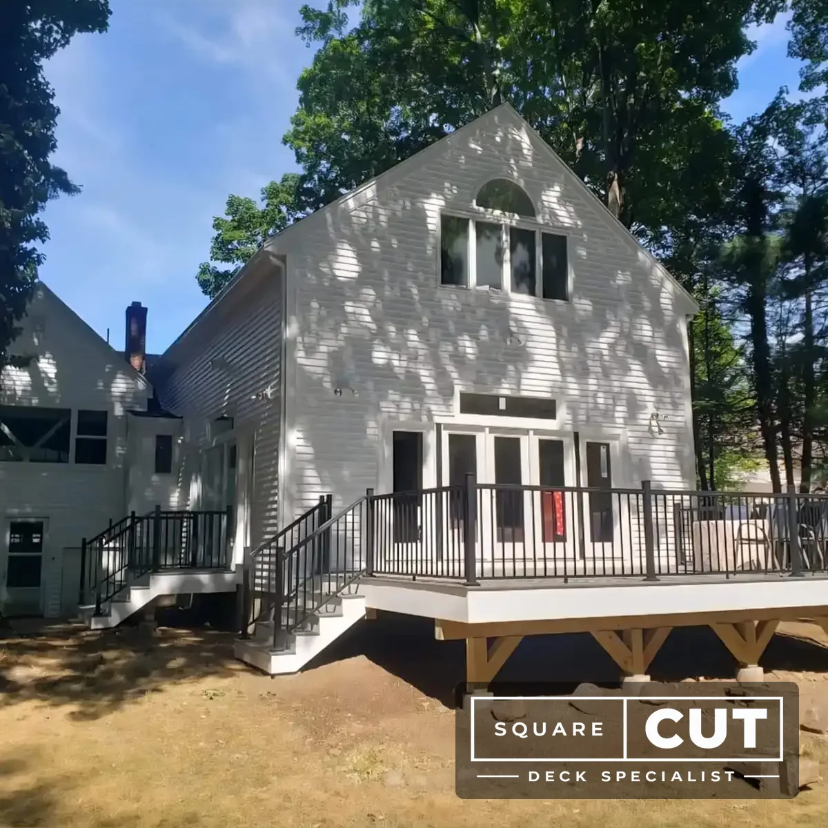 Full deck view — composite with black aluminum railings